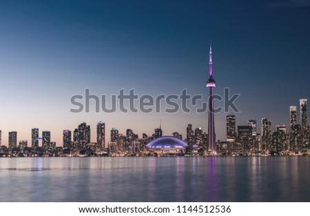 Toronto skyline at night with faded effect.