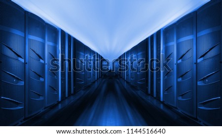 Network and internet communication technology concept, data center interior, server racks with telecommunication equipment in server room