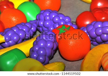 Pattern of toys in the form of fruits and vegetables