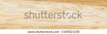 The texture of the wooden house. Logs the texture of the wooden house. Shield with a large number of parallel wooden logs texture