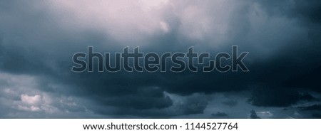 Clouds in the dark sky of the sky. Monochrome image. Web banner.