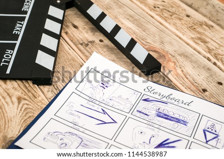 clapperboard, storyboard on wood Royalty-Free Stock Photo #1144538987