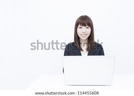 Young business woman with laptop computer