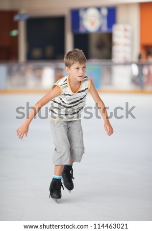 Ice skating little boy