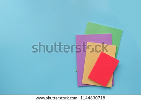 Creative, fashionable, minimalistic, Back to school education concept, school supplies stationery equipment on blue backboard Flat lay with copy space.