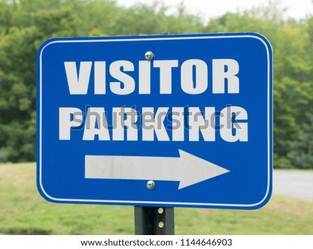 Blue Visitors Parking sign