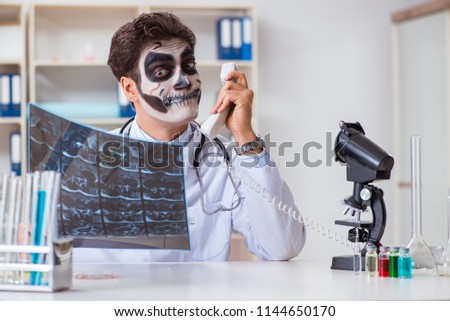 Scary monster doctor working in lab Royalty-Free Stock Photo #1144650170