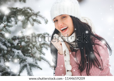 Portrait of young beautiful woman in winter