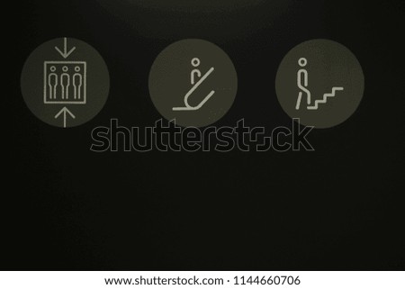 Picture of symbol to elevator, escalator, and stairs with black background