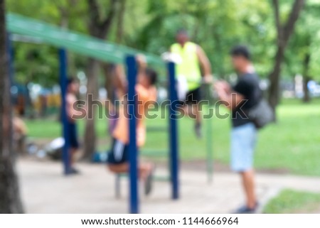 Abstract Blurred image of people exercising at public outdoor place in the morning.