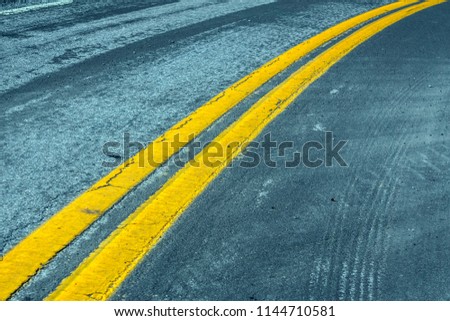 asphalt road with double yellow line