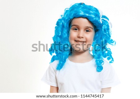 Beautiful little girl dressed up like a doll with turquoise hair (isolated on white)
