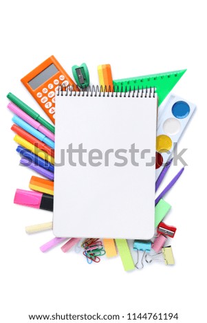 School supplies with blank sheet of paper on white background