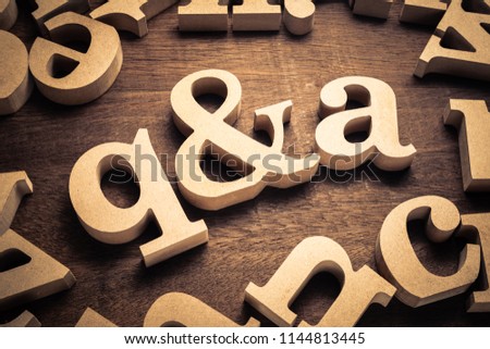 Question and Answer, q and a by wood letters on wood background