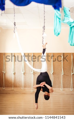 emotional development from anti-gravity yoga classes. back view full length photo