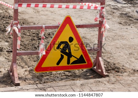 Warning sign road works. Road repair.