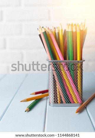 Colorful pencils in modern classroom