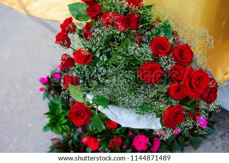 Bouquet of red roses on a black background. Top view.
