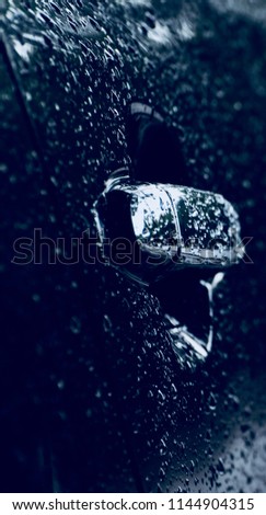 Isolated wet cars door knob unique blurry photograph