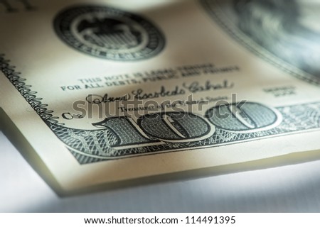 Corner of hundred dollar bills