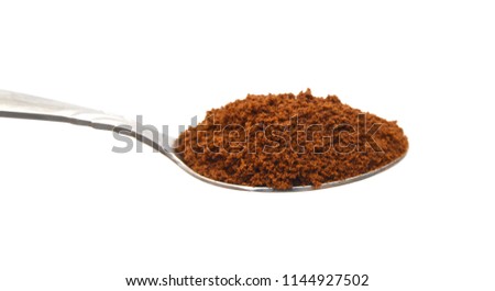 Pile of powdered, instant coffee and beans isolated on white background