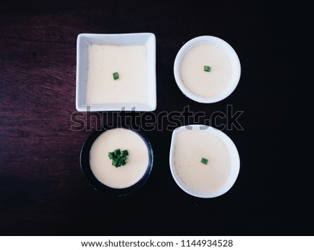 Top view picture of steamed egg  on black background.