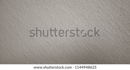 Close up shot of textured white canvas board with lines which can be used as background