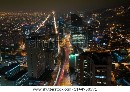 View of Bogota at night in the financial center with modern buildings in the downtown. Colombia. Royalty-Free Stock Photo #1144958591