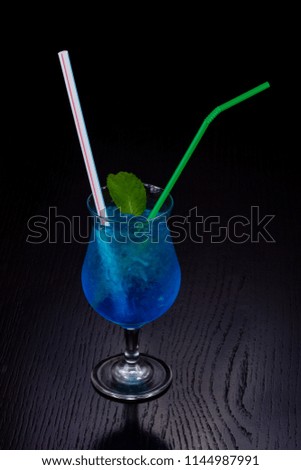 Sweet blue curacao cocktail with mint