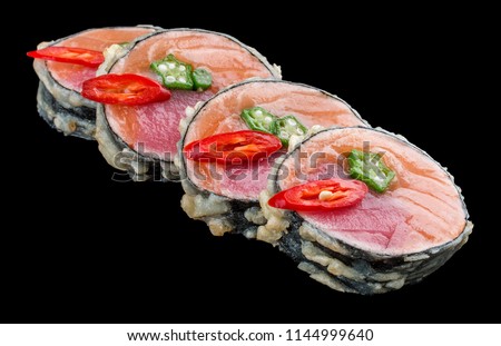 Sushi roll with salmon and tuna on black background