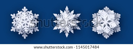 Vector set of 3 white Christmas paper cut 3d snowflakes with shadow on dark blue background. New year design elements Royalty-Free Stock Photo #1145017484