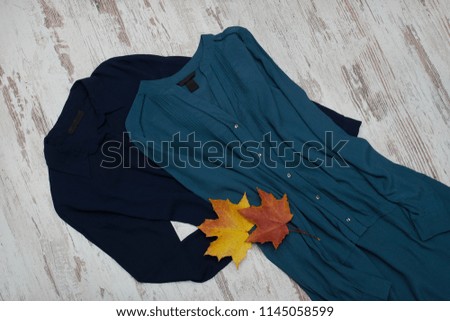 Two long shirts and maple leaves. Fashionable concept.