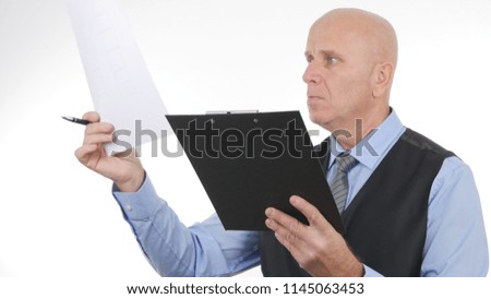 Confident Businessman Image Reading Financial Documents