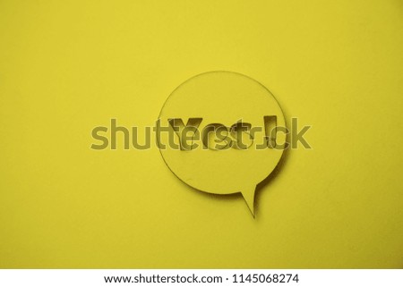 Speech bubble sticker with yes. Paper cut work.