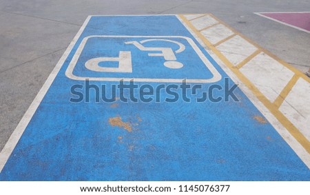 Signs and letters for the parking of the disabled.