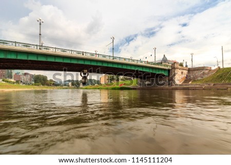 The Green Bridge is a bridge over the Neris River in Vilnius, Lithuania, that connects the city center with the district of Snipiskes.