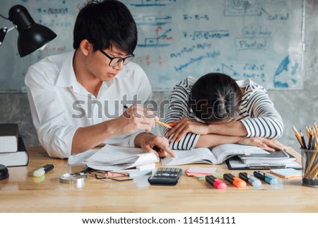 High school or college Asian student group sitting at desk in class studying and reading, doing homework and lesson practice preparing exam to entrance, education concept.