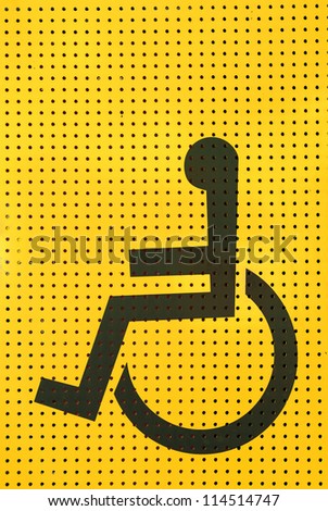 sign disabled icon on yellow grating metal