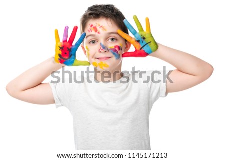adorable schoolboy showing painted hands with smiley icons isolated on white