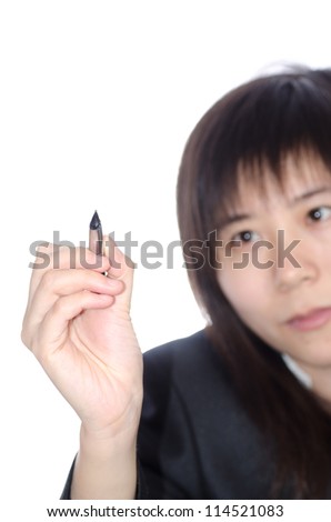 Asian business woman writing something with a pen isolated