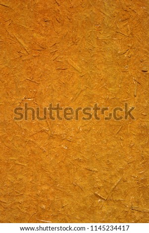 Photo of an old orange wooden board texture consist of wood sawdust