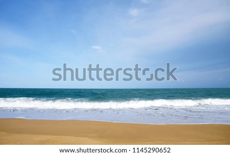 Sea wave White and blue ocean with sandy beach Background in Summer holidays Time of Happiness