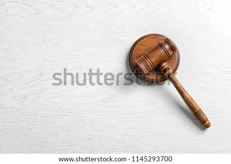 Judge's gavel on light background, top view. Law concept Royalty-Free Stock Photo #1145293700