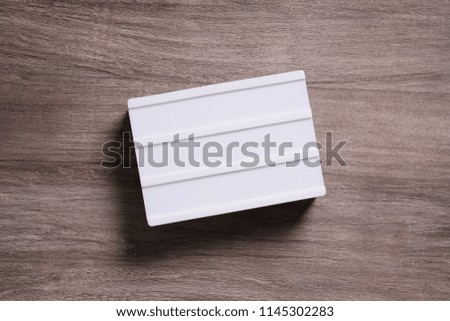 blank light box sign on wooden background