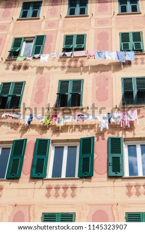 Typical and colorful house with with clothes drying at the open air in Camogli