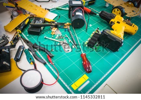 Engineer tools for repair electronic devices close up. Special instruments for modern gadgets maintenance, Technician workplace in service center, Top view background