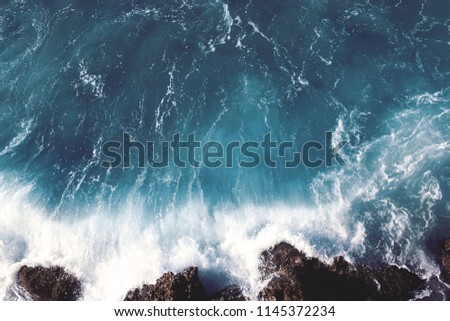 view of dark sea landscape background, water splashing waves on the rocks