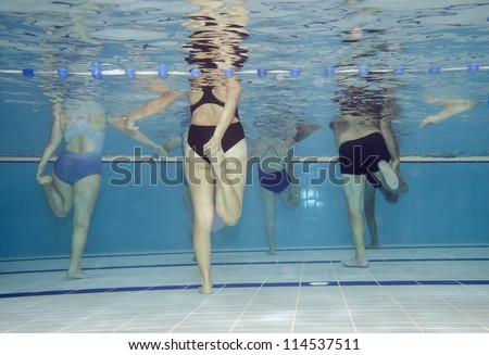 Underwater picture of an aerobics class.