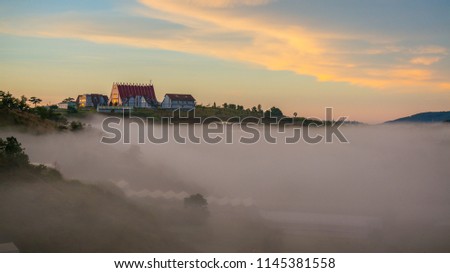 the catholic church on the hill in Da lat, in the sun light and fog