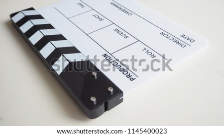  Clapper board or movie slate use in video production or movie and cinema industry. It's white color on white background. 